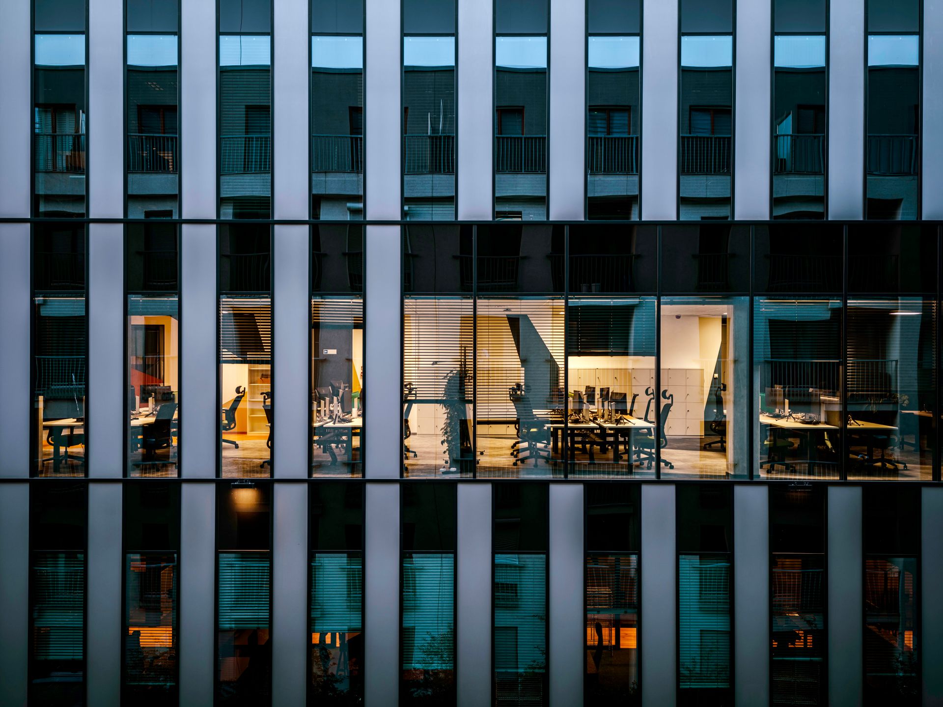 Modern building with interior lighting at dusk